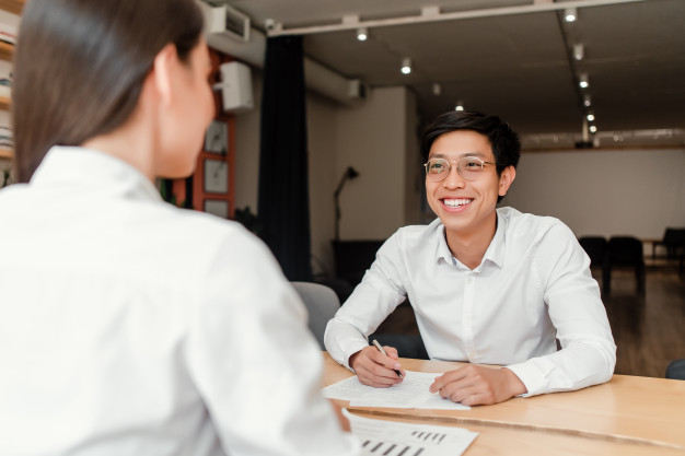 young-asian-businessman-job-interview-with-woman