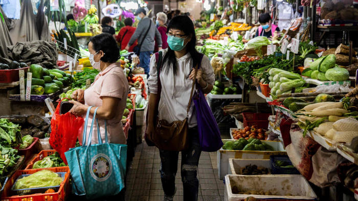 women shopping at a wet market