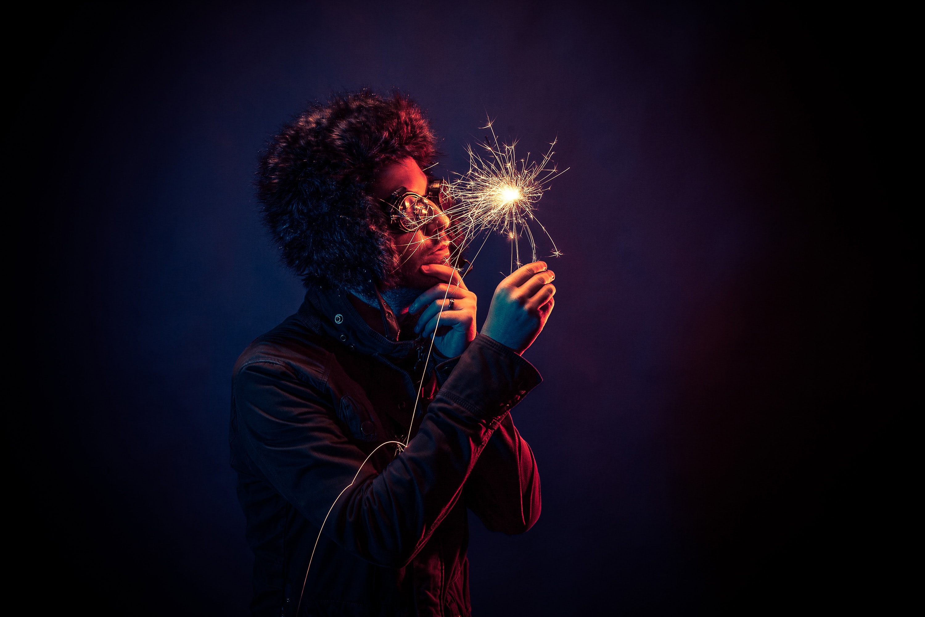 a man holding a sparkle