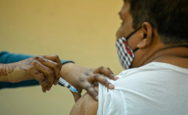 a man receiving an injection