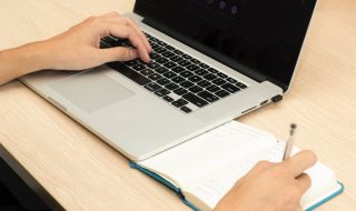 a person using laptop while researching