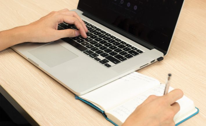 a person using laptop while researching