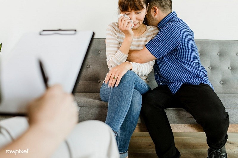 a woman crying during marriage counseling