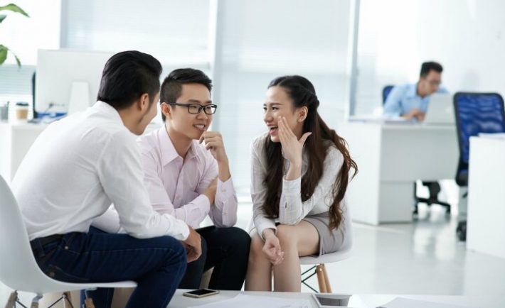 colleagues gossiping in the office