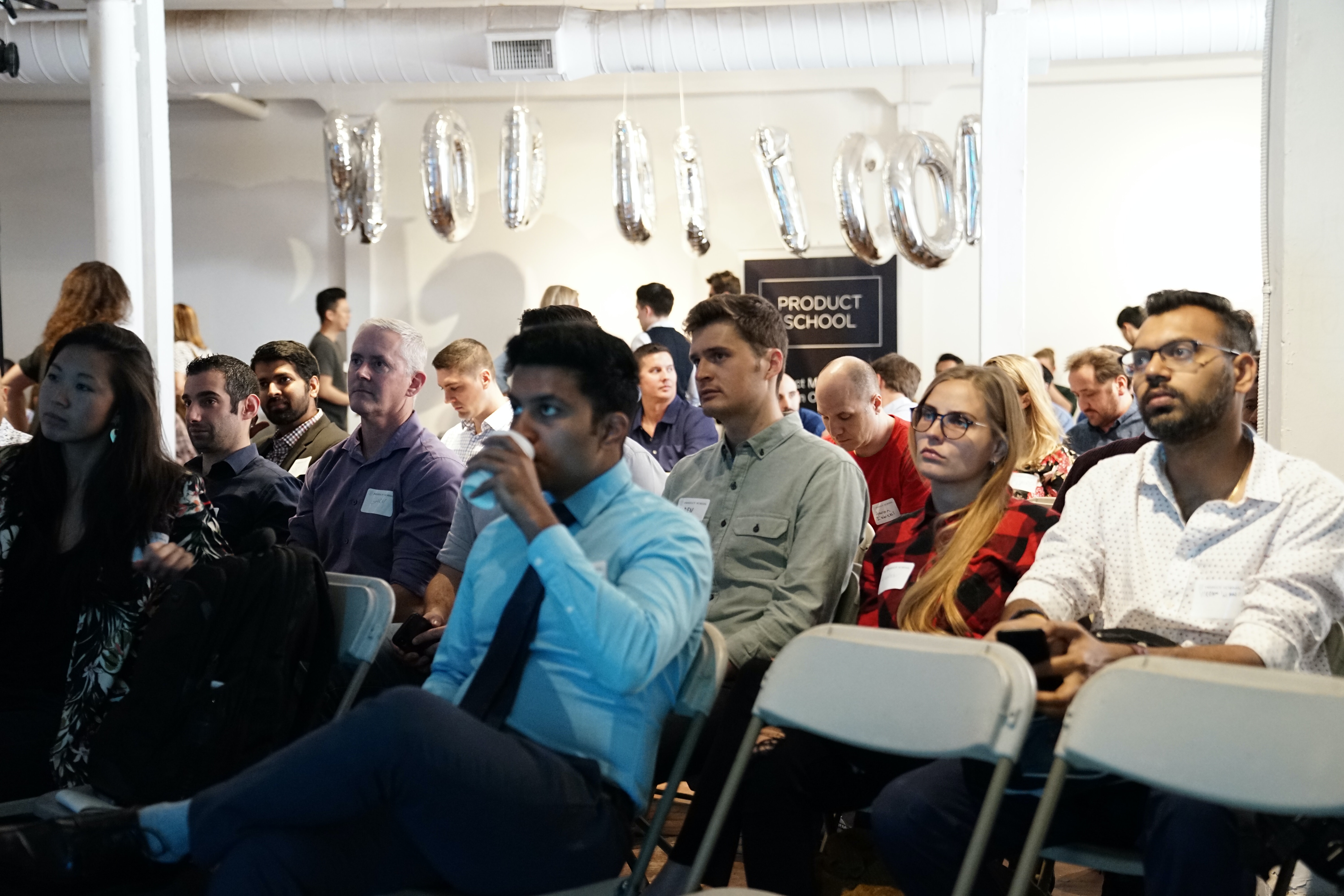 audience listening to a speaker