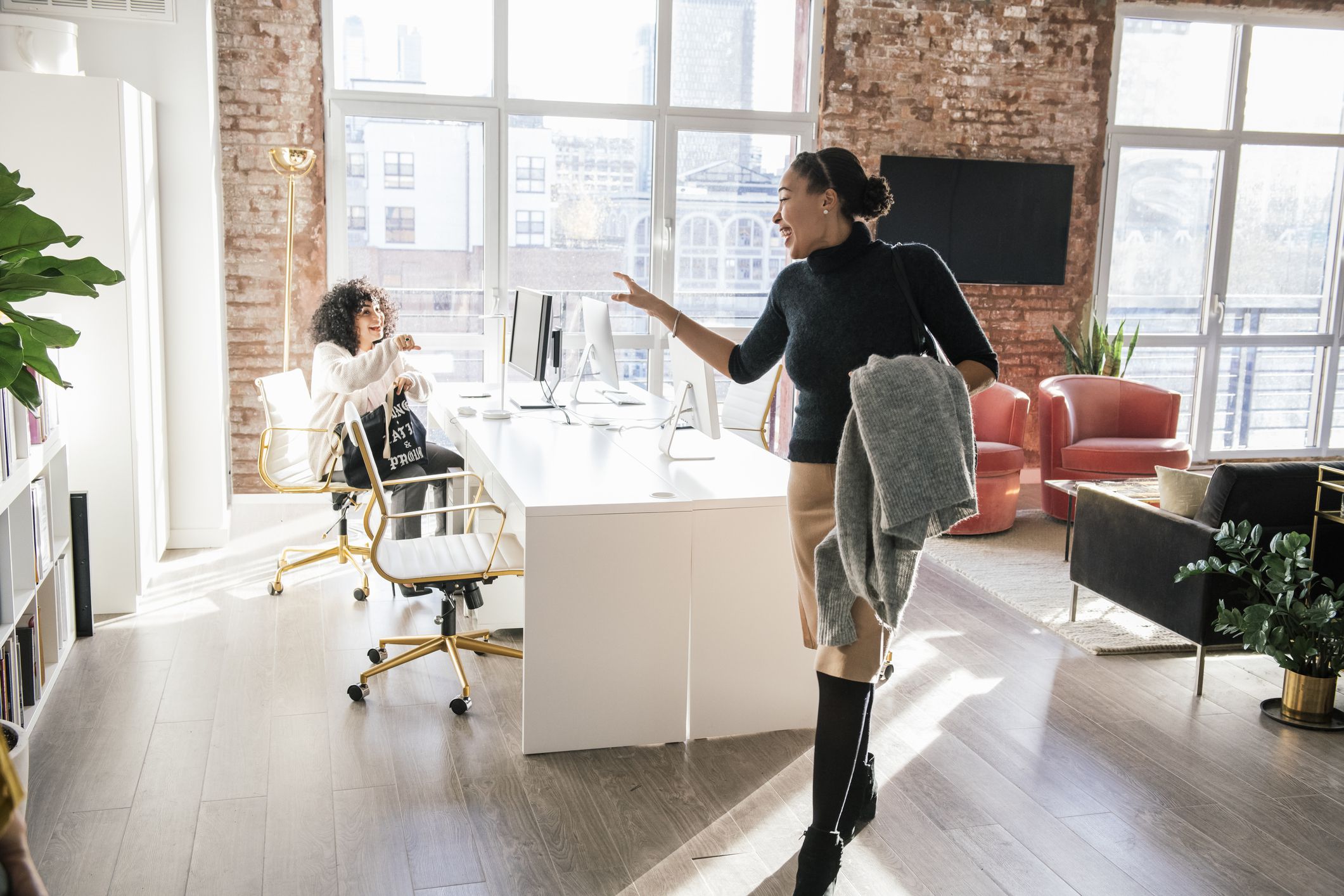 a woman happily knocking off from work