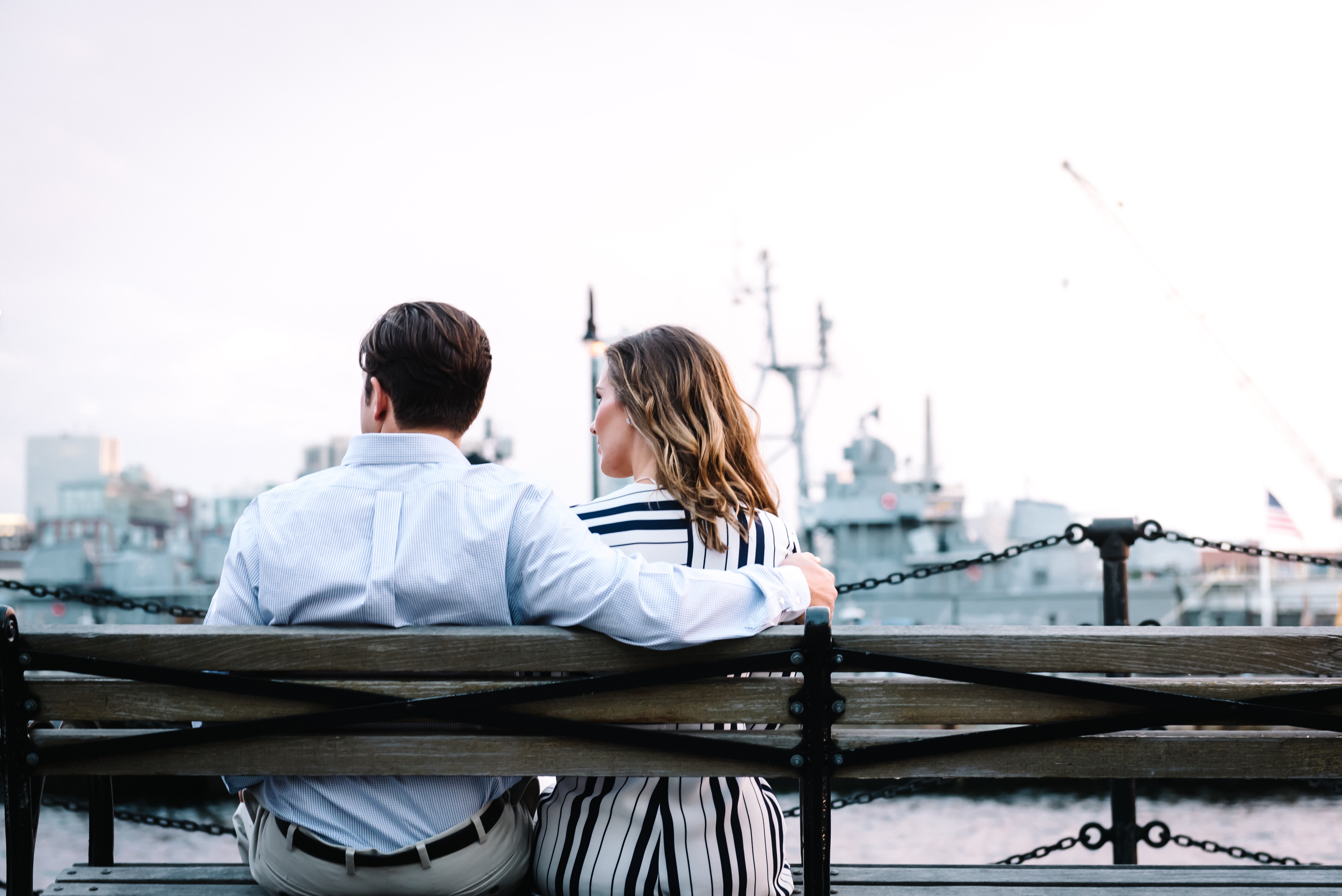 a couple sitting on a bench