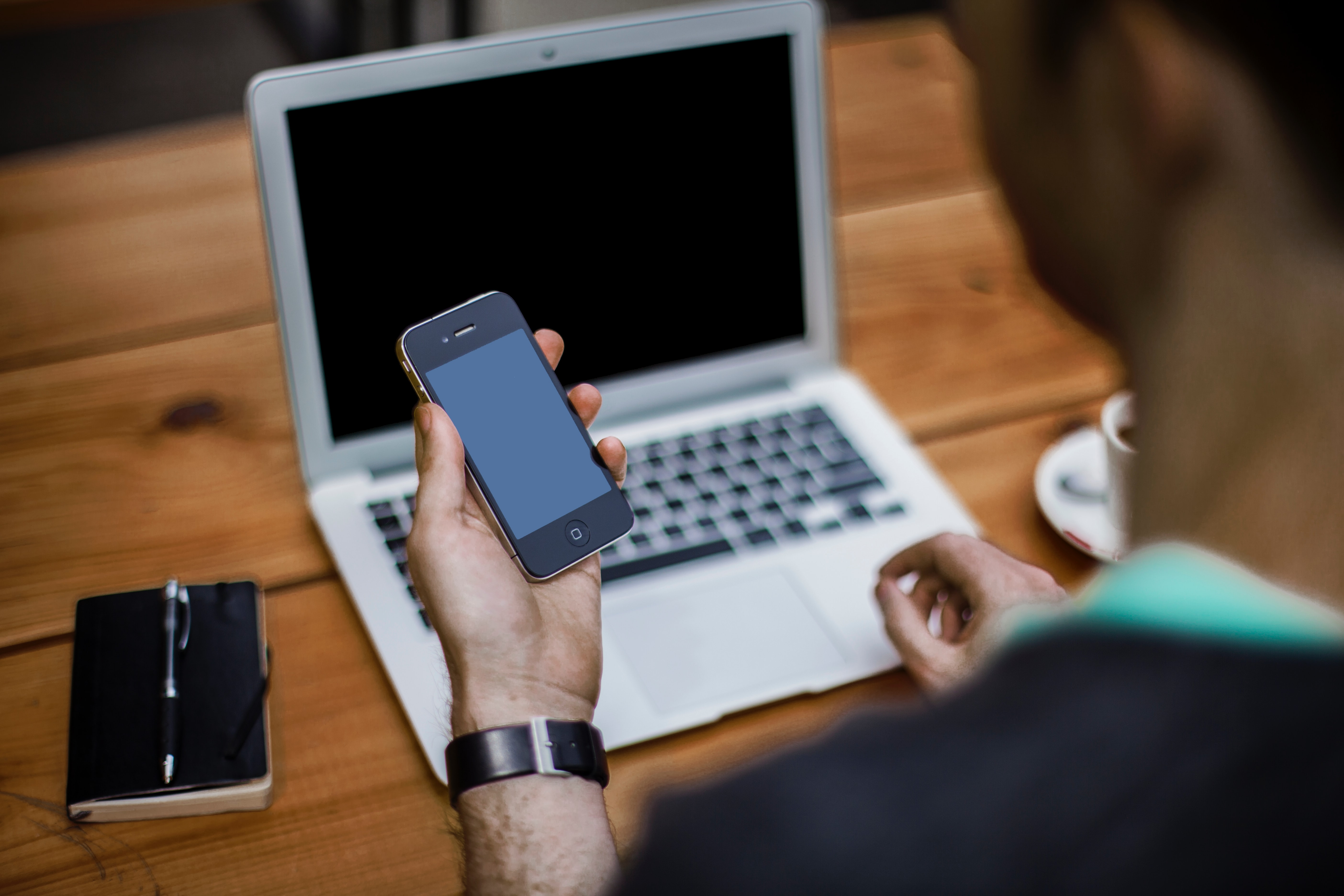 man with smartphone and laptop