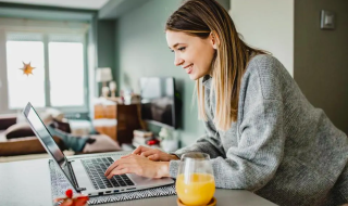 woman typing on her laptop