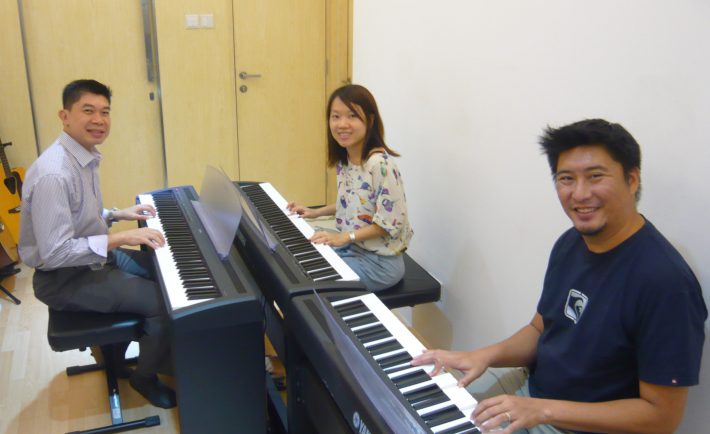 adults having piano lessons