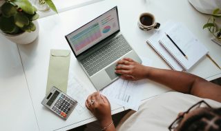 a lady sitting at a table budgeting