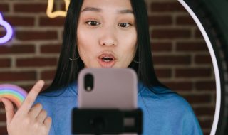 lady speaking in front of the camera