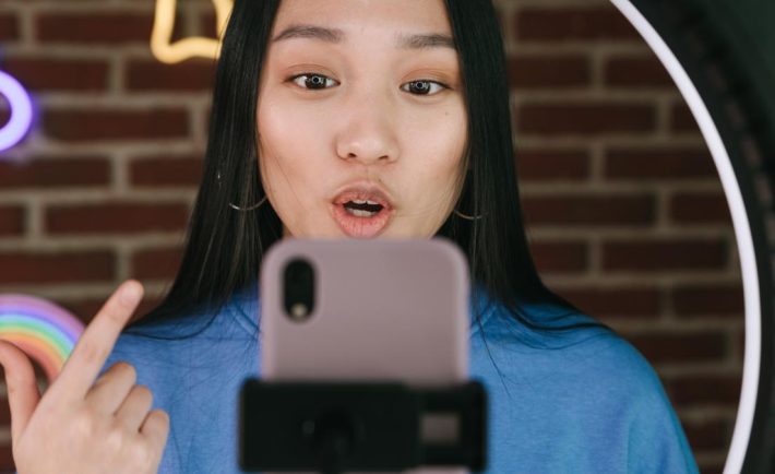 lady speaking in front of the camera