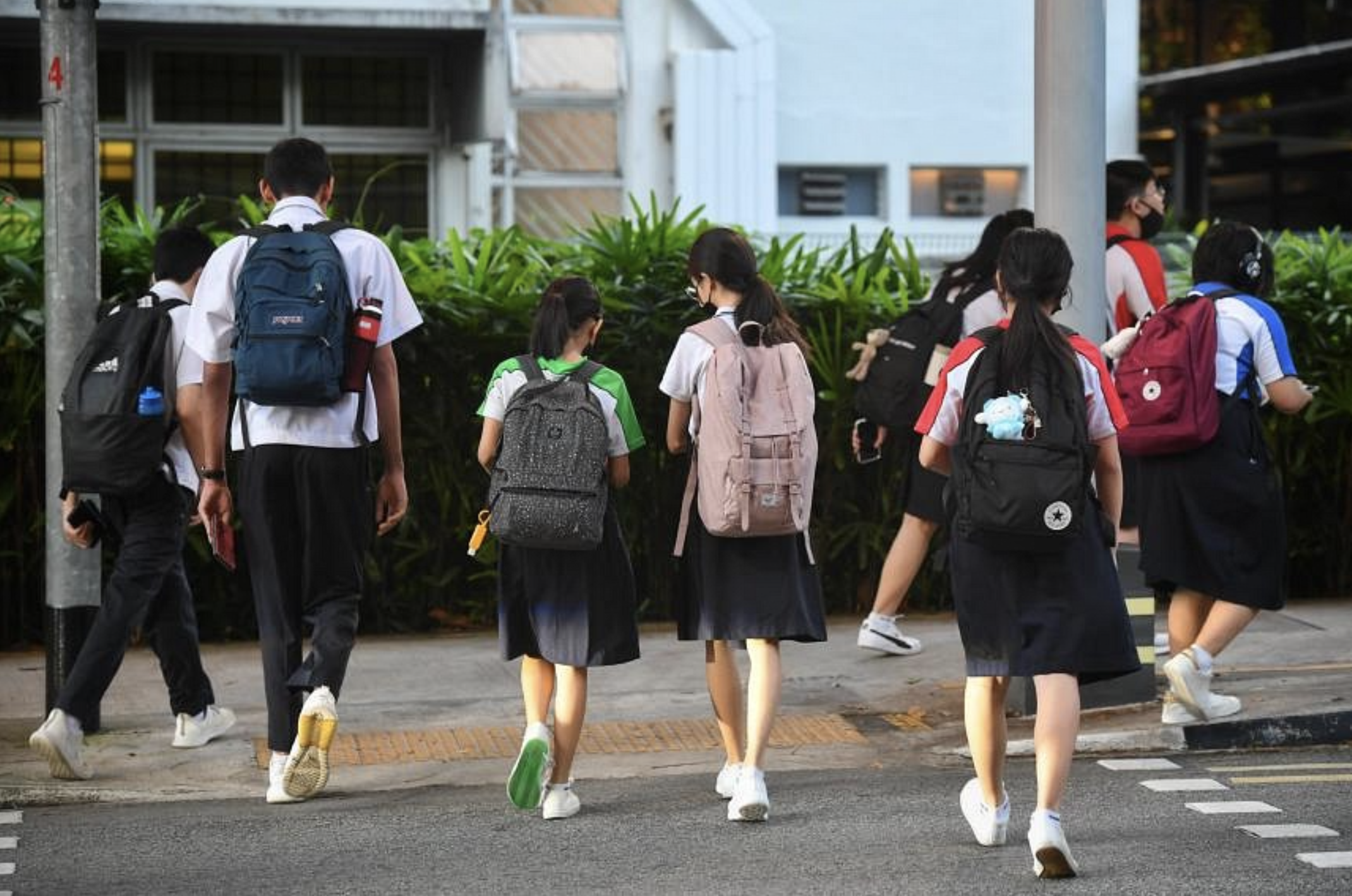 Singapore students crossing the road