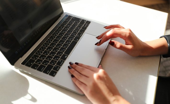 hands on a MacBook