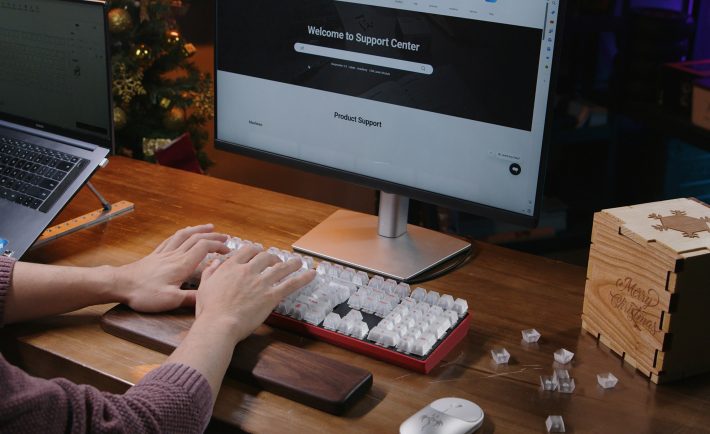 a person typing on a keyboard